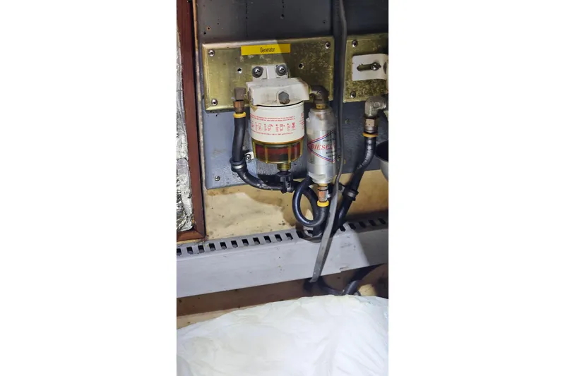 Slide: The Image of Engine compartment of 1984 Albin Palm Beach 37 with diesel filter system. - 66