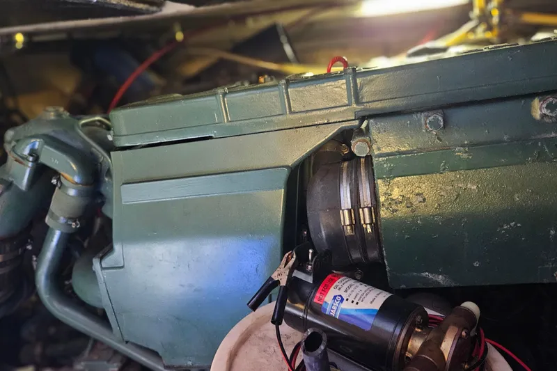 Slide: The Image of Engine compartment of a 1984 Albin Palm Beach 37 boat, showcasing mechanical components. - 67