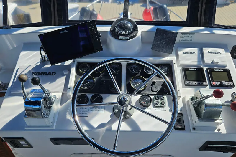 Slide: The Image of 1984 Albin Palm Beach 37 helm with Simrad navigation and control systems. - 16