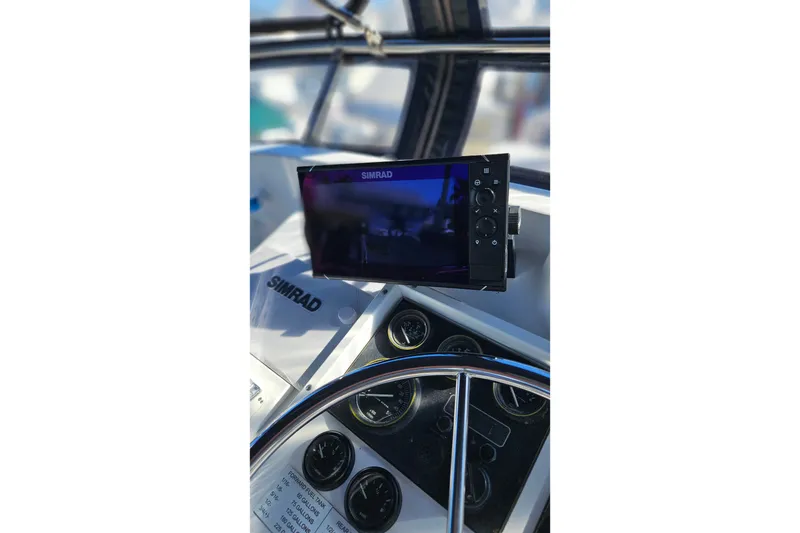 Slide: The Image of Simrad navigation system on 1984 Albin Palm Beach 37 boat dashboard. - 21