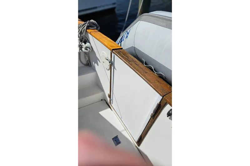 Slide: The Image of 1984 Albin Palm Beach 37 boat deck with wooden trim and ropes. - 26