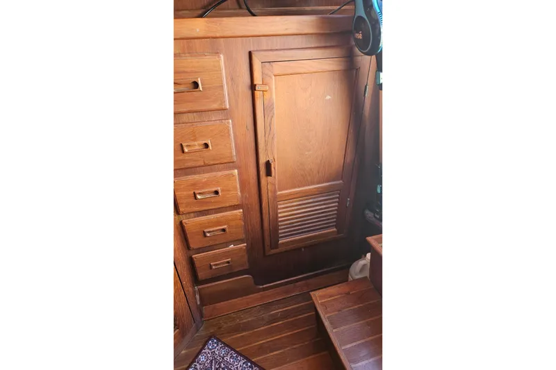 Slide: The Image of 1984 Albin Palm Beach 37 interior with wooden cabinetry and drawers. - 33