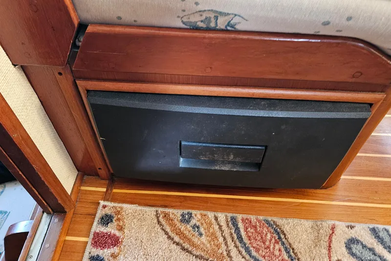 Slide: The Image of Interior of 1984 Albin Palm Beach 37 with wooden paneling and patterned carpet. - 37