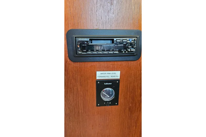 Slide: The Image of 1984 Albin Palm Beach 37 interior with Kenwood stereo and water tank level indicator. - 42
