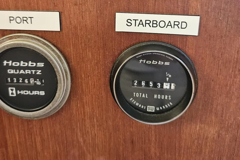 Slide: The Image of Hour meters on 1984 Albin Palm Beach 37 boat dashboard, showing port and starboard readings. - 43