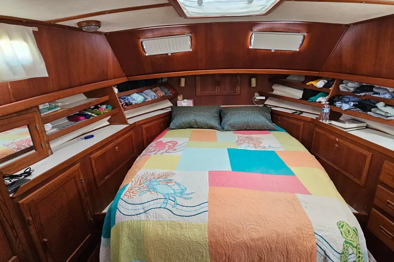 Slide: The Image of Cozy cabin interior of 1984 Albin Palm Beach 37 with colorful quilted bedspread. - 55