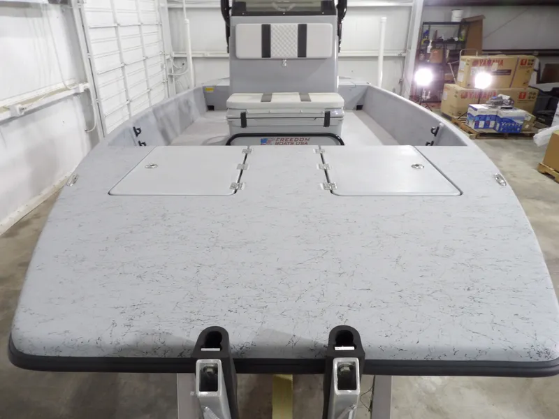 Slide: The Image of 2024 Freedom 18 PATRIOT CAT boat in a garage. - 11