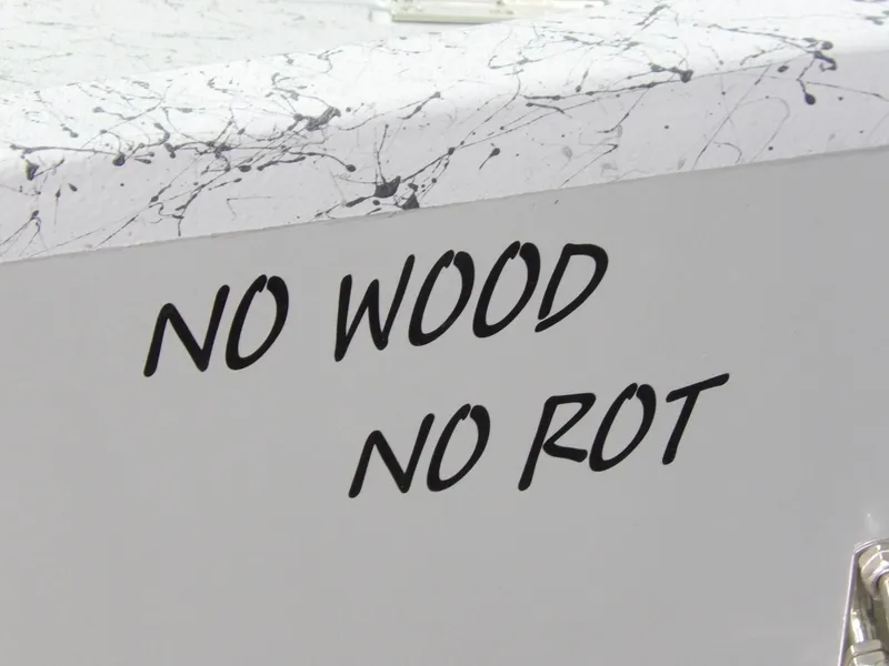 Slide: The Image of Close-up of 'No Wood No Rot' text on a boat. - 9