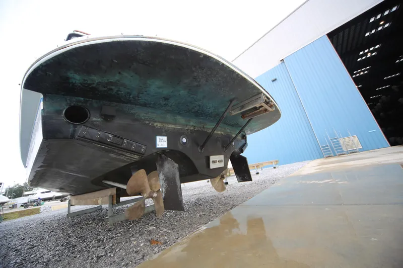 Slide: The Image of 2014 San Juan 41 boat hull and propeller near blue warehouse. - 11