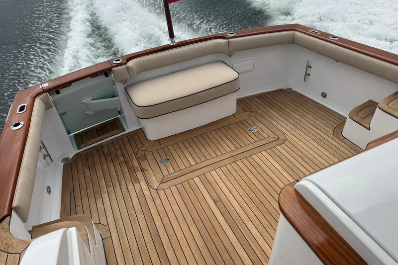 Slide: The Image of Luxurious 2014 San Juan 41 boat deck with teak flooring and cushioned seating. - 14