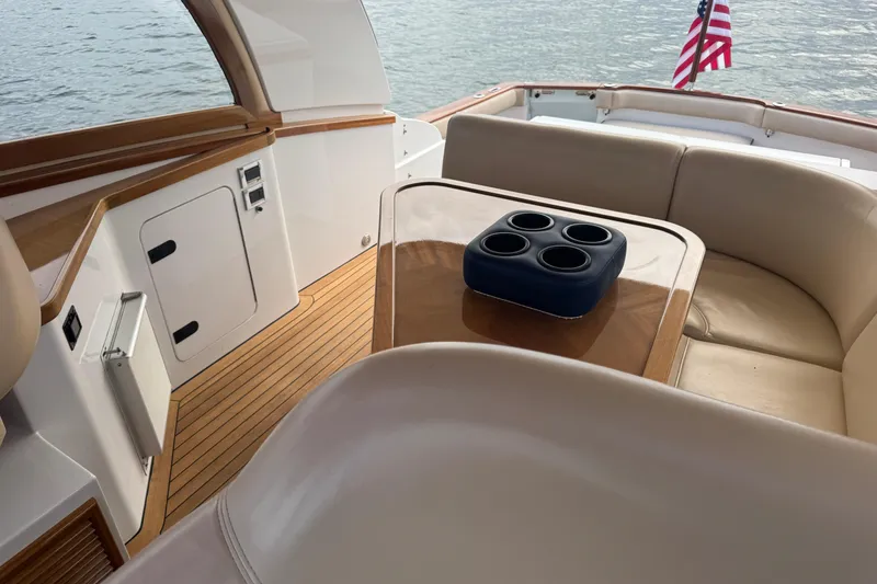 Slide: The Image of Luxurious 2014 San Juan 41 yacht interior with elegant seating and table, overlooking water. - 17