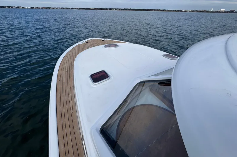 Slide: The Image of 2014 San Juan 41 yacht on calm water, featuring sleek deck design. - 22