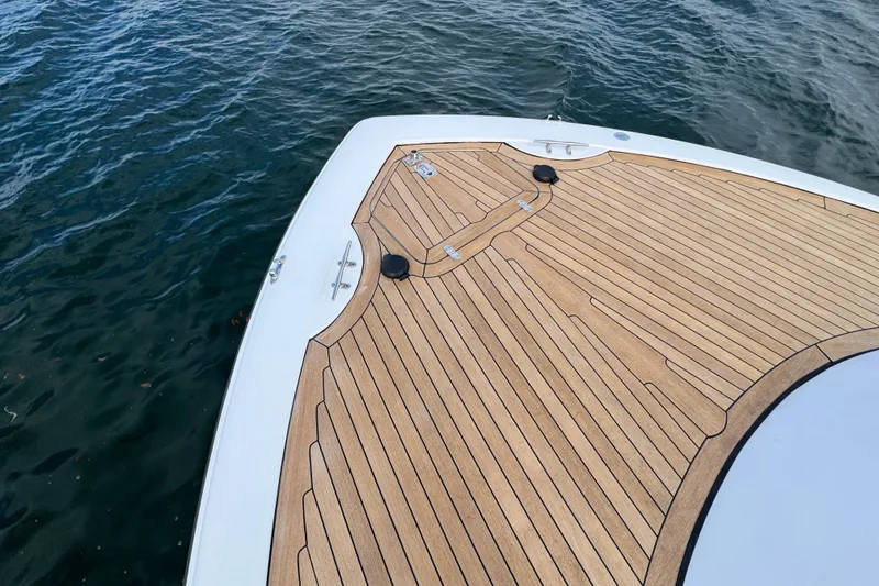 Slide: The Image of Bow of 2014 San Juan 41 yacht with teak decking on calm water. - 23
