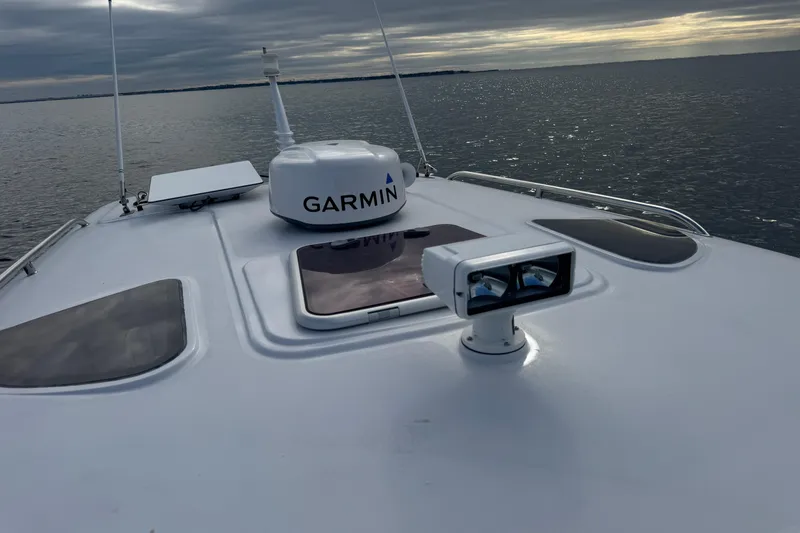 Slide: The Image of San Juan 41 boat with Garmin equipment on calm water, cloudy sky, 2014 model. - 26