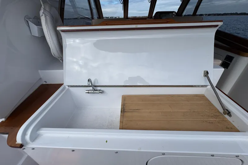Slide: The Image of San Juan 41 yacht interior sink area with wooden accents, 2014 model. - 28