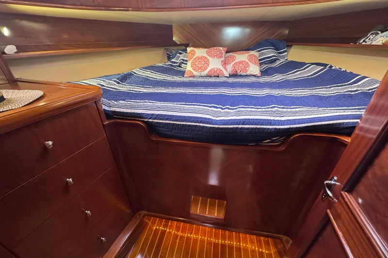 Slide: The Image of Luxurious cabin interior of 2014 San Juan 41 yacht with cozy bedding and wooden finish. - 31