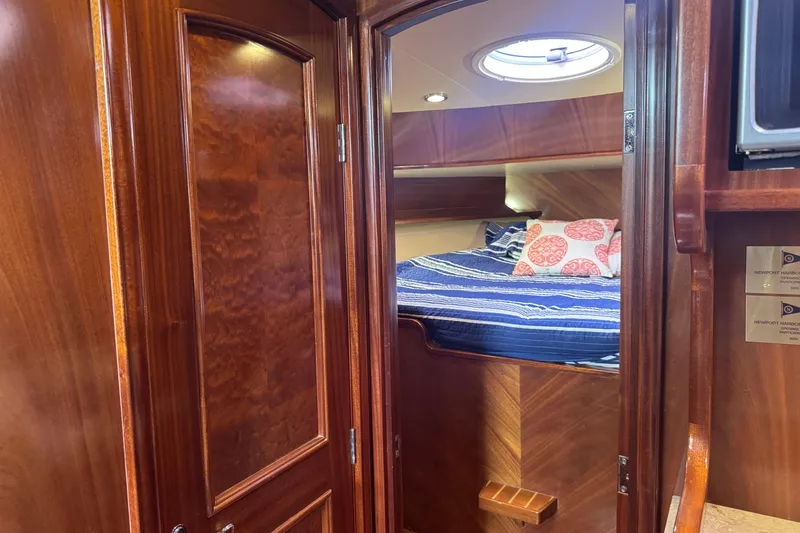 Slide: The Image of Luxurious wooden interior of 2014 San Juan 41 yacht cabin with cozy bed. - 32
