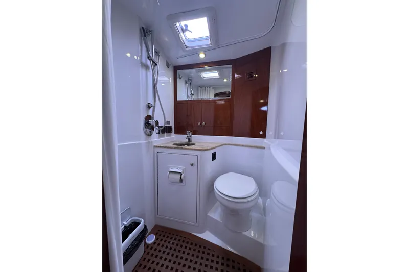 Slide: The Image of Luxurious bathroom in 2014 San Juan 41 yacht with modern fixtures and wooden accents. - 33