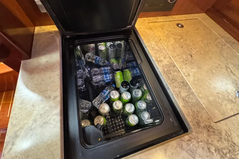 Slide: The Image of Beverage cooler on 2014 San Juan 41 yacht, stocked with drinks and water bottles. - 36
