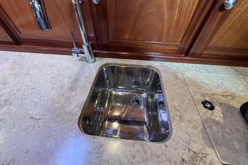 Slide: The Image of Stainless steel sink in a 2014 San Juan 41 yacht's elegant wooden interior. - 38
