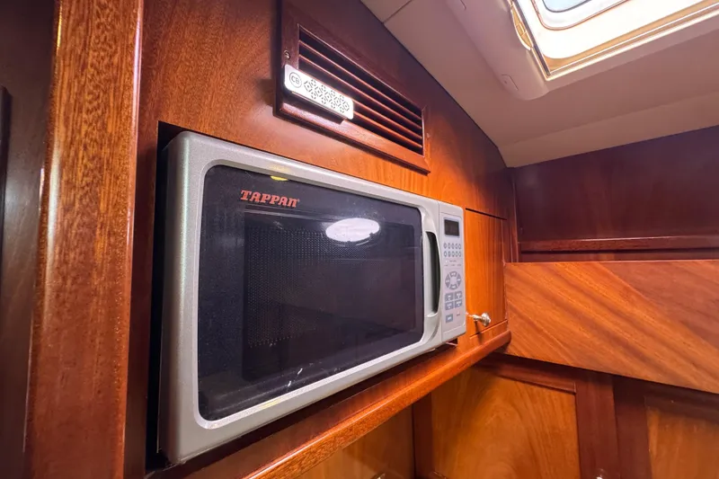 Slide: The Image of Microwave in 2014 San Juan 41 yacht interior with wooden cabinetry. - 40