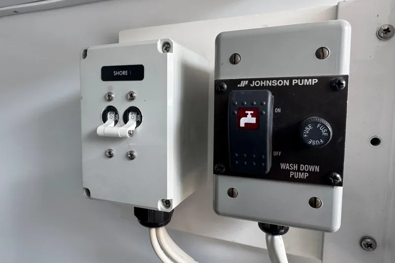 Slide: The Image of Electrical panel with Johnson Pump controls on a 2014 San Juan 41 boat. - 43
