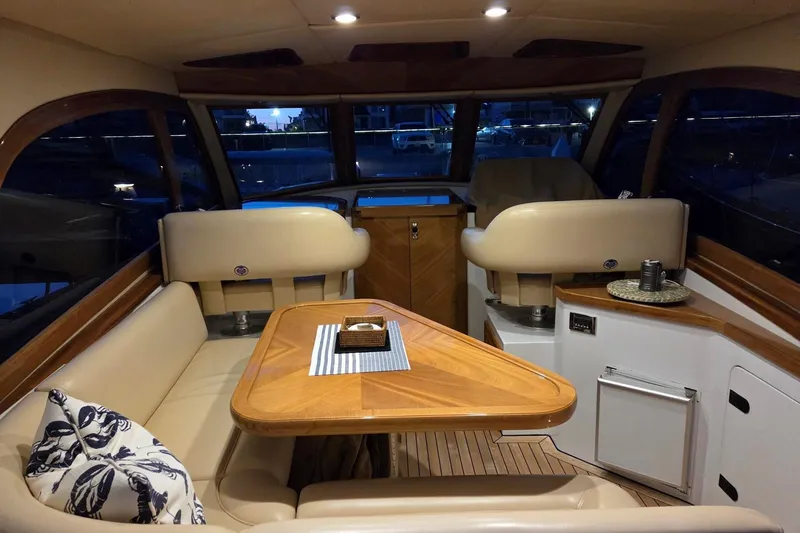 Slide: The Image of Luxurious interior of 2014 San Juan 41 yacht with elegant seating and wooden table. - 52