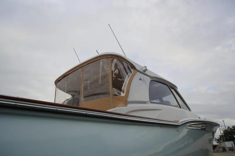 Slide: The Image of 2014 San Juan 41 boat with enclosed cockpit under cloudy sky. - 6