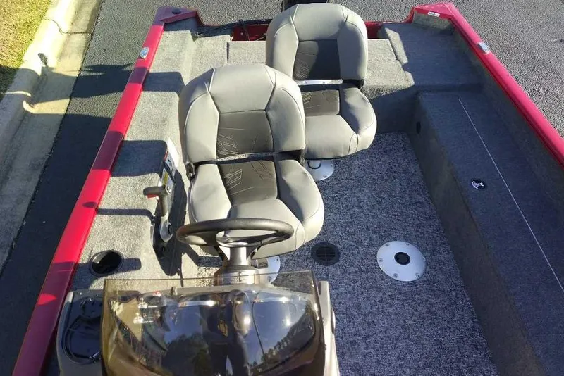 Slide: The Image of 2026 Tracker Super Guide V-16 SC boat interior with two seats and steering console. - 4