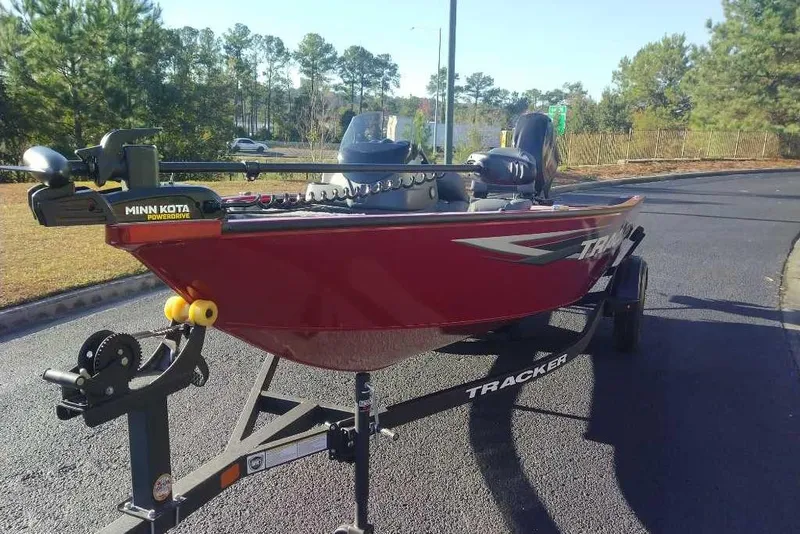 Slide: The Image of 2026 Tracker Super Guide V-16 SC boat on trailer, featuring Minn Kota PowerDrive motor. - 7