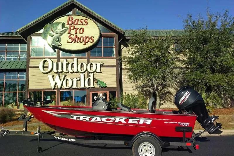 Slide: The Image of 2026 Tracker Super Guide V-16 SC boat outside Bass Pro Shops Outdoor World. - 9