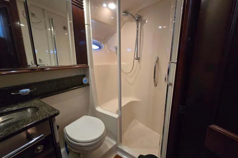 Slide: The Image of Luxurious bathroom in 2007 Sea Ray 52 Sedan Bridge yacht with shower and vanity. - 46