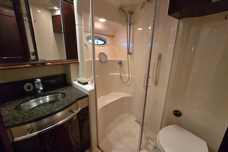Slide: The Image of Luxurious 2007 Sea Ray 52 Sedan Bridge interior with elegant wood finishes and nautical decor. - 54