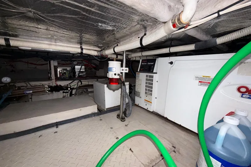 Slide: The Image of Engine room of 2007 Sea Ray 52 Sedan Bridge with batteries and wiring. - 61