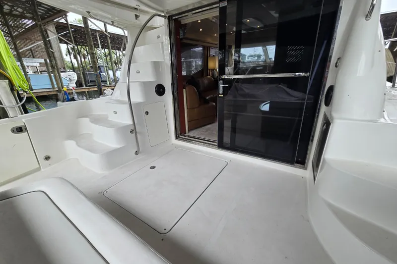 Slide: The Image of 2007 Sea Ray 52 Sedan Bridge yacht interior with seating and open cabin view. - 9