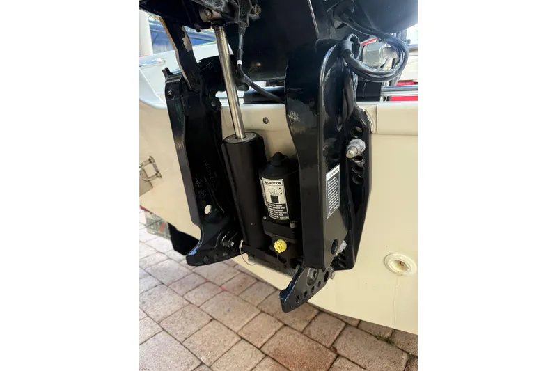 Slide: The Image of Close-up of 2016 Boston Whaler 170 Super Sport boat engine mount on tiled surface. - 10