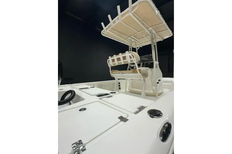 Slide: The Image of 2023 NauticStar 227 XTS boat interior with T-top and storage compartments. - 10
