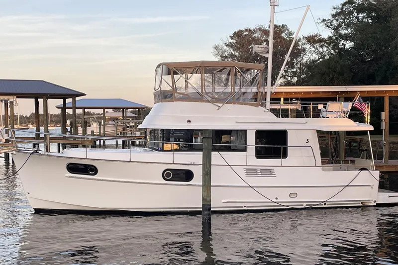 The Image of 2013 Beneteau Swift Trawler 44 docked at marina, side view. - 1