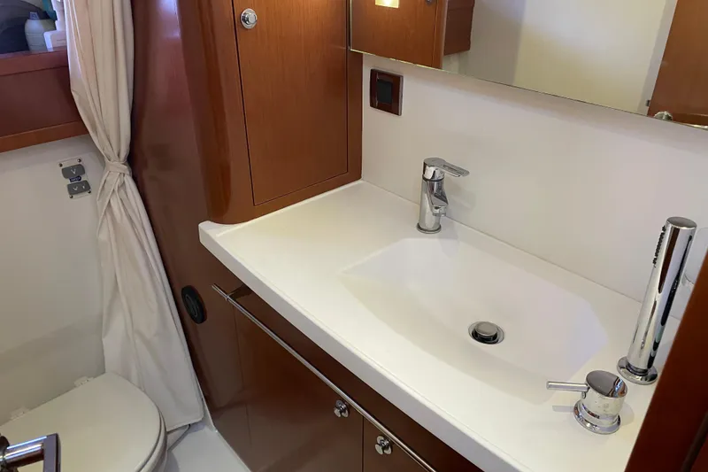 Slide: The Image of Bathroom interior of 2013 Beneteau Swift Trawler 44 with modern sink and fixtures. - 34