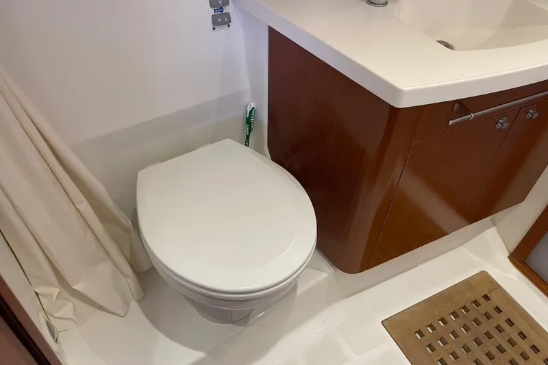Slide: The Image of Bathroom interior of 2013 Beneteau Swift Trawler 44 with toilet and sink. - 43