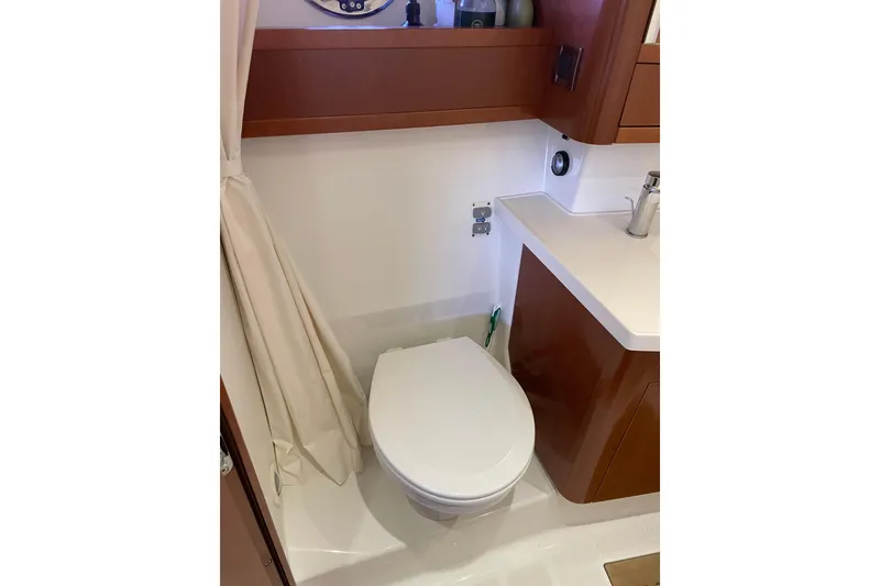 Slide: The Image of Bathroom interior of 2013 Beneteau Swift Trawler 44 with toilet and sink. - 45