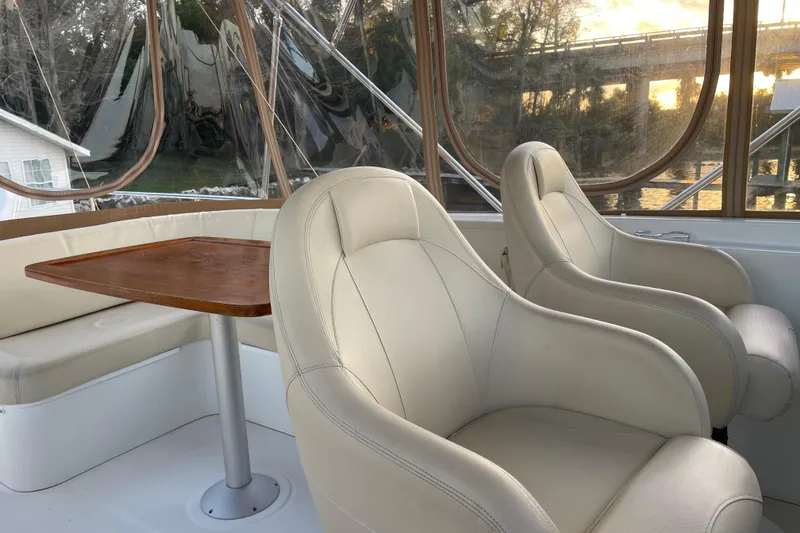 Slide: The Image of Interior of 2013 Beneteau Swift Trawler 44 with leather seats and wooden table. - 51