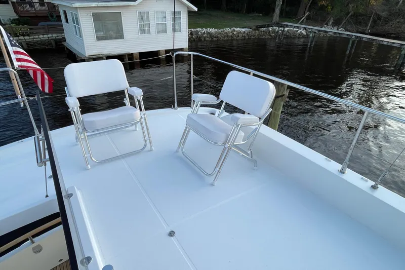 Slide: The Image of Deck of 2013 Beneteau Swift Trawler 44 with chairs and water view. - 55