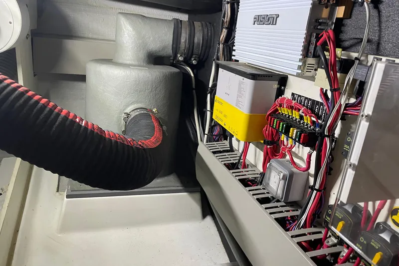 Slide: The Image of Engine room of 2013 Beneteau Swift Trawler 44 with electrical components and wiring. - 63