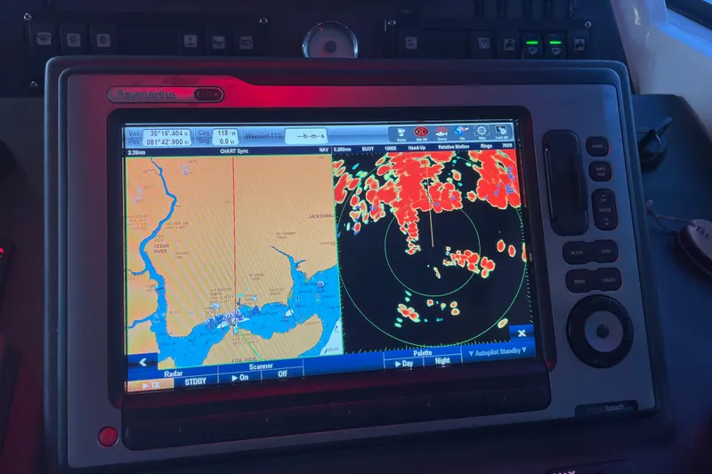 Slide: The Image of Navigation system on 2013 Beneteau Swift Trawler 44 displaying radar and map. - 72