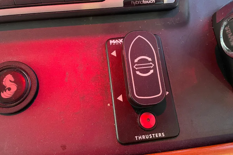 Slide: The Image of Control panel of a 2013 Beneteau Swift Trawler 44, featuring thruster controls. - 74