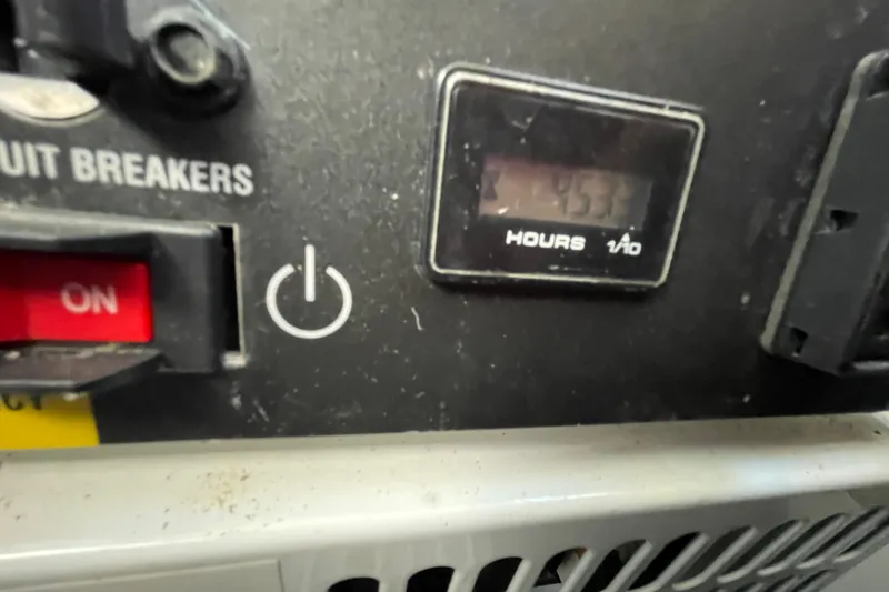 Slide: The Image of Control panel of a 2013 Beneteau Swift Trawler 44 with hour meter and circuit breaker. - 76