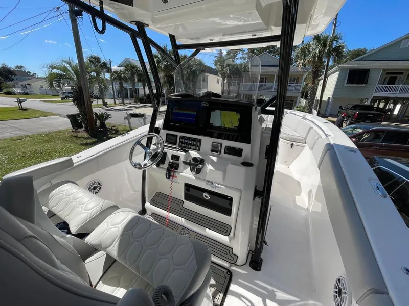 Slide: The Image of 2024 Sea Fox 288 Commander boat interior with modern dashboard and seating. - 12