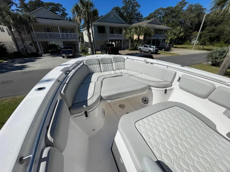 Slide: The Image of 2024 Sea Fox 288 Commander boat with spacious seating, parked in a residential area. - 13