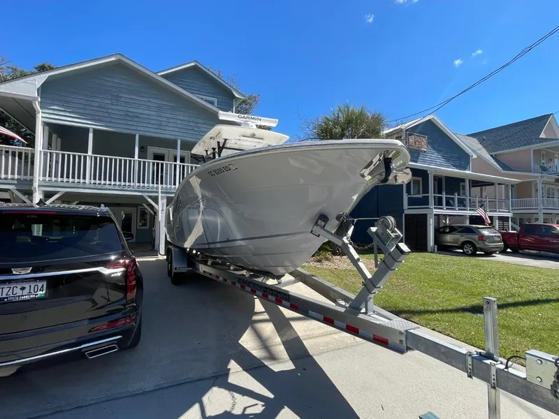 Slide: The Image of 2024 Sea Fox 288 Commander boat on trailer in residential driveway. - 2